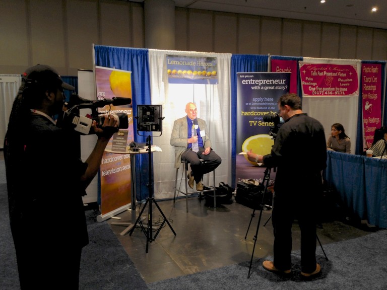 Aaron Sylvan interviewing entrepreneurs for Lemonade Heroes, at Javits Convention Center