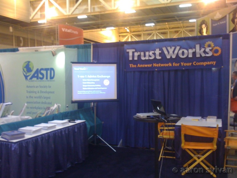 TrustWorks - booth at SHRM with neighbors visible