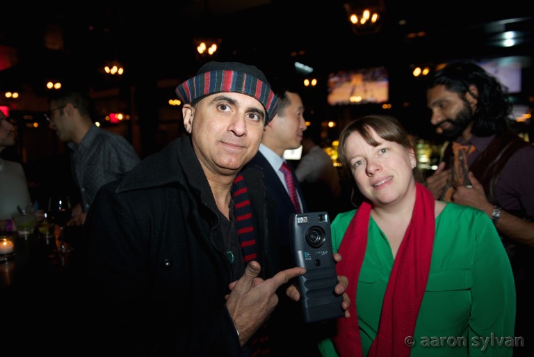 Denny Daniel shows off one of the world's first digital cameras, to Janet Esquirol.